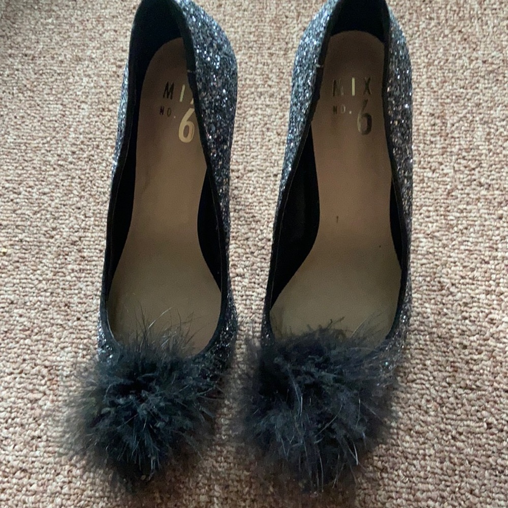 Sparkly black heels with pop Pom front